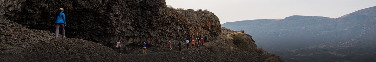EPSS students hiking across a columnar jointed basalt mountain.